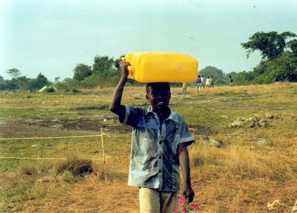 1995 boy carrying water uganda