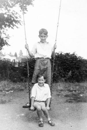 1953 img521 JLW and CTW on swings in Kington