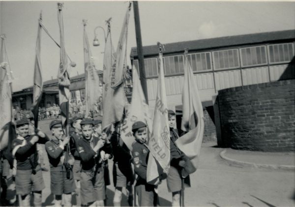 1956 Chris with the Cub Flag at Court House Station.  3rd from left